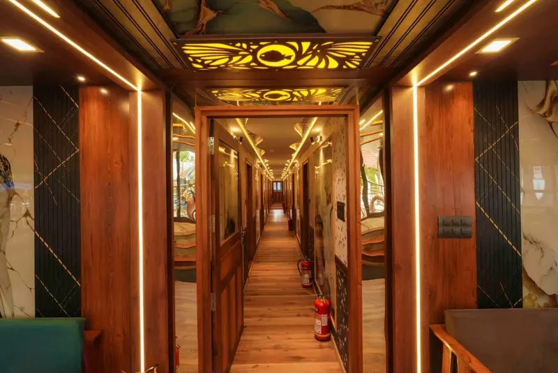 Corridor of bedrooms with lit fish-motif panels