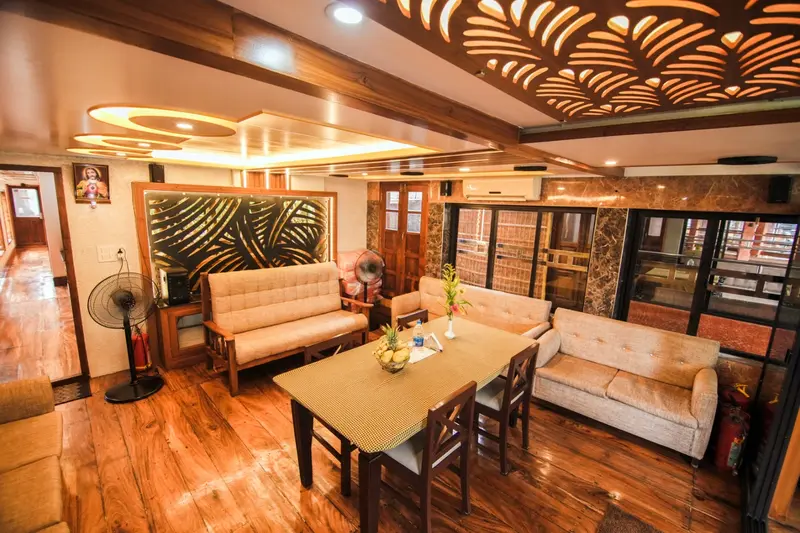 Houseboat saloon with sofas and dining table