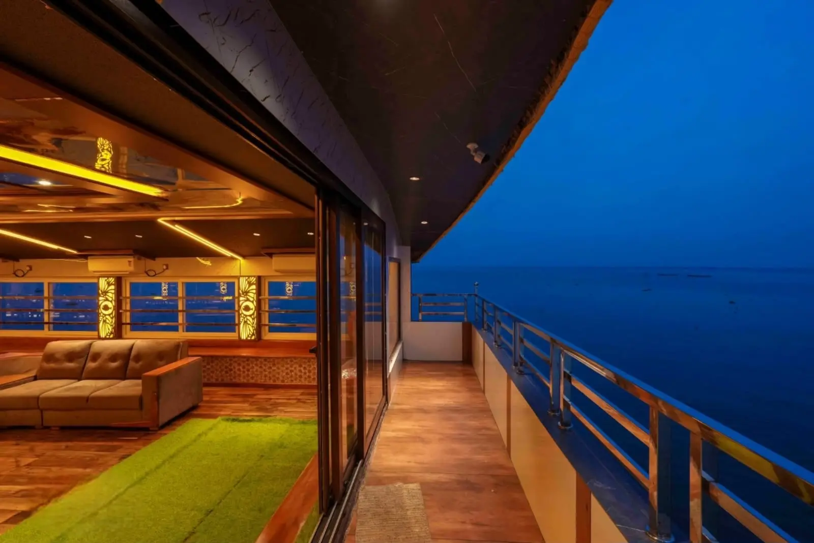 Houseboat balcony deck at dusk over Vembanad Lake